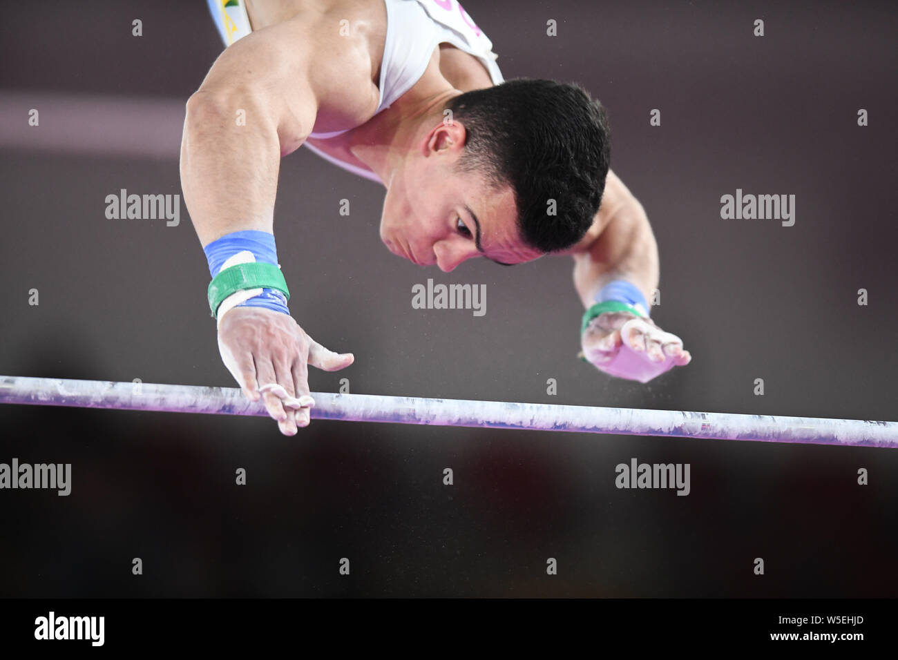 Lima, Peru. 28th July, 2019. CAIO SOUZA from Brazil competes on the high bar during the team finals competition held in the Polideportivo Villa El Salvador in Lima, Peru. Credit: Amy Sanderson/ZUMA Wire/Alamy Live News Stock Photo