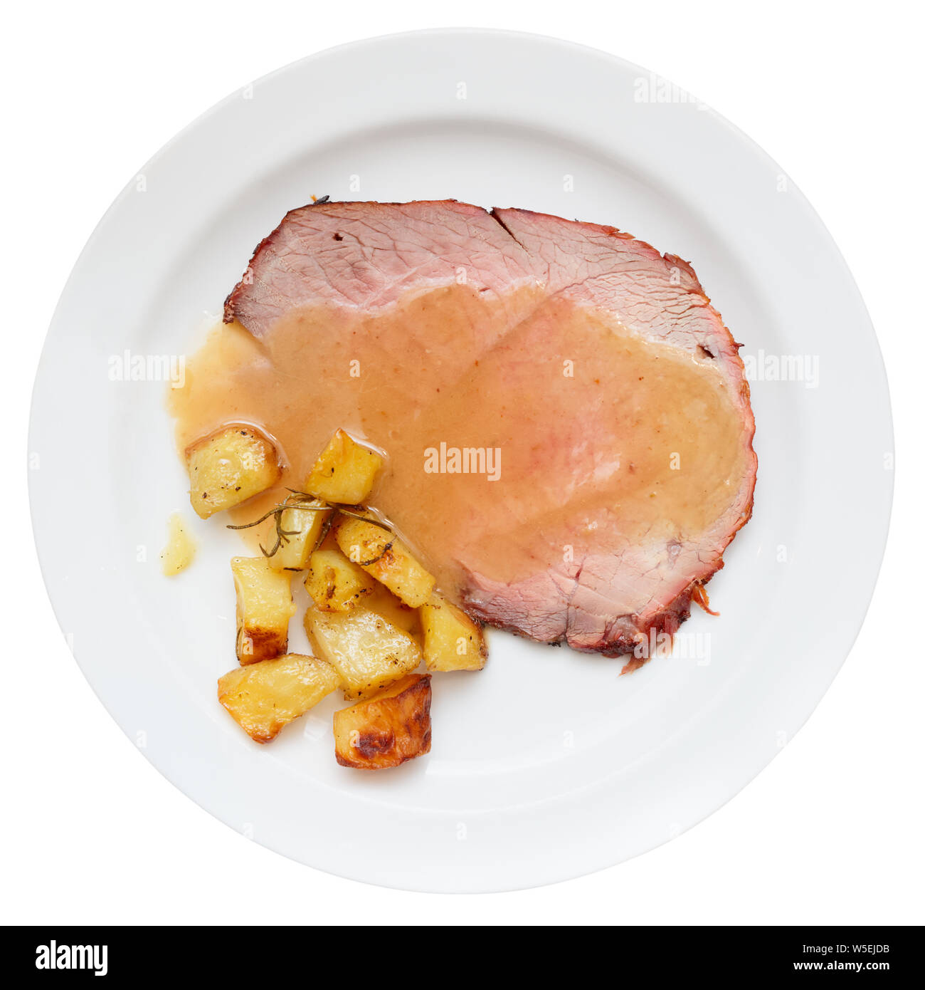 Roasted veal fillet with fried potatoes, isolated on white Stock Photo