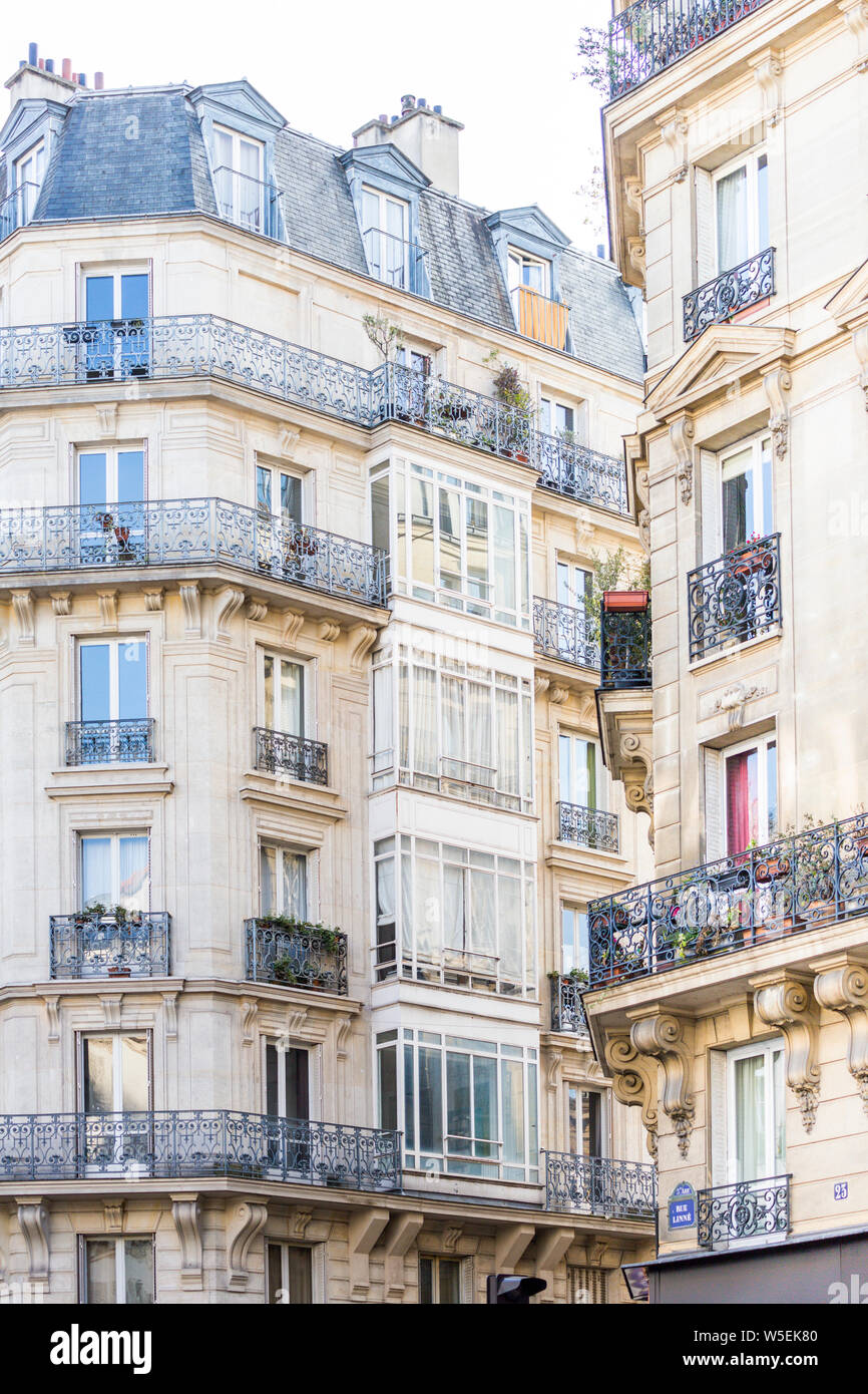 Haussmann style apartment buildings with ornate ironwork railings, Paris 5th Arrondissement Stock Photo