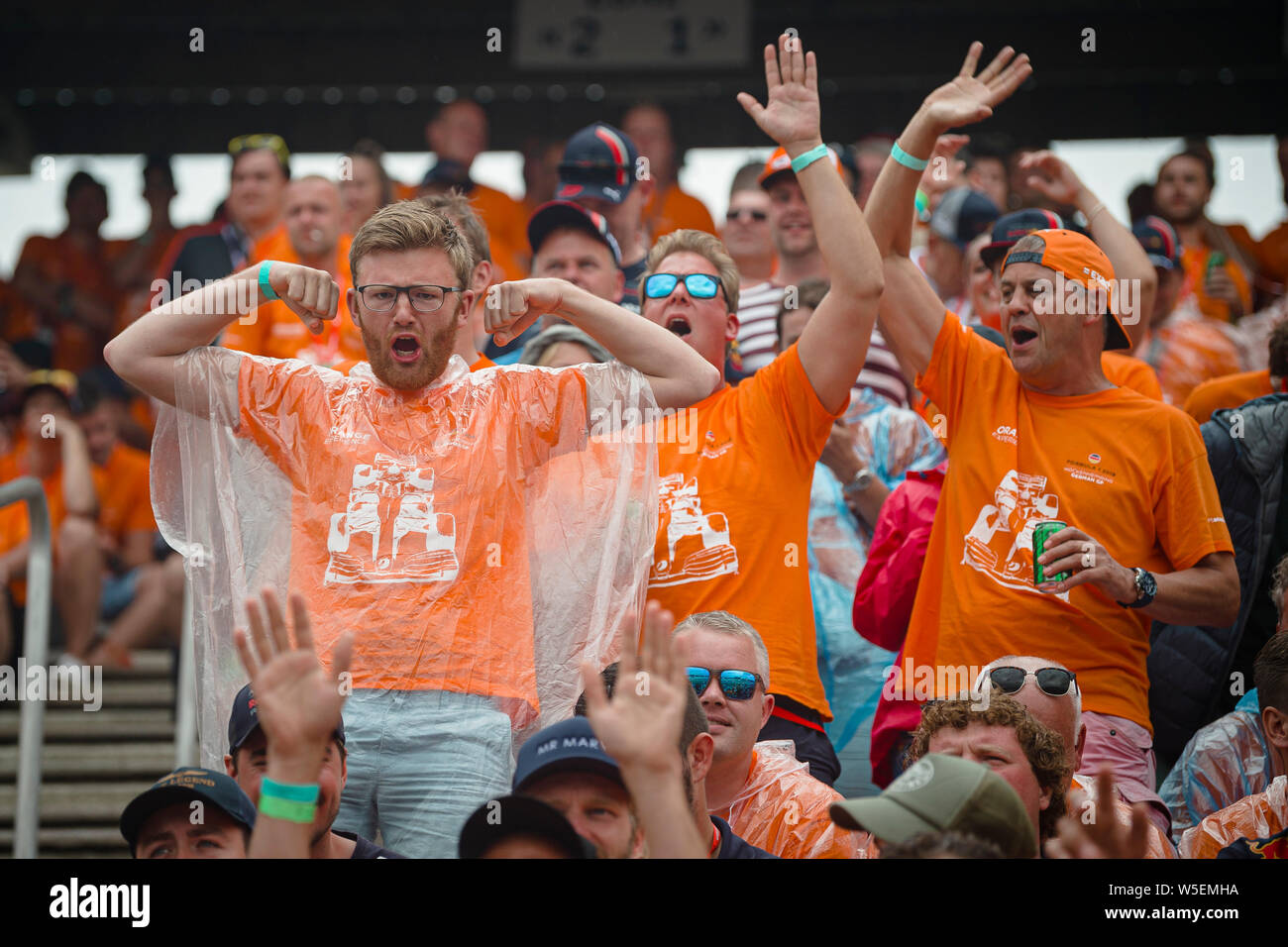 Hockenheim, Germany. 28th July, 2019. Dutch fans of Max Verstappen cheer during the German F1 Grand Prix race. Credit: SOPA Images Limited/Alamy Live News Stock Photo