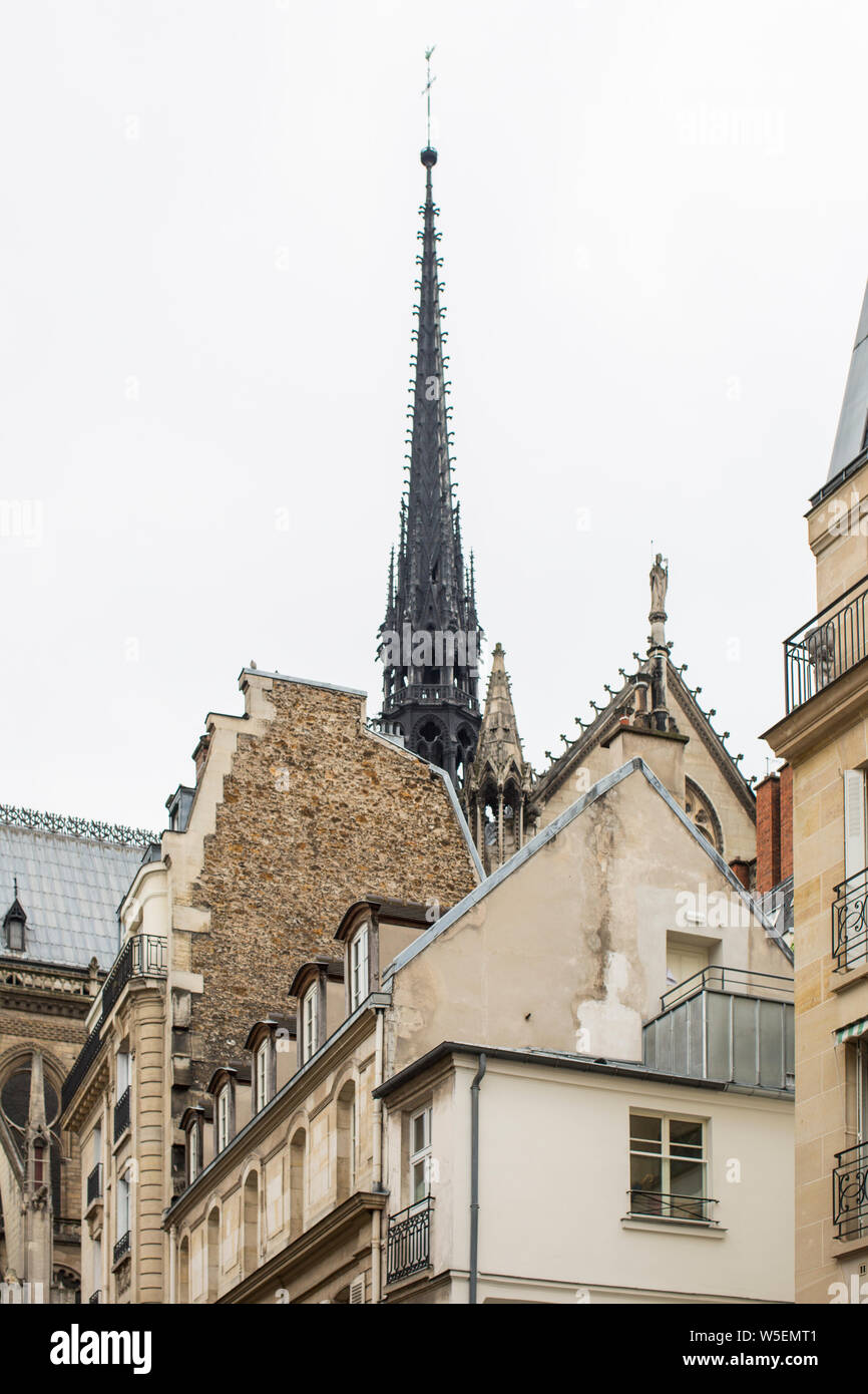 Notre Dame Cathedral on Ile de la Cite from street level with apartment buildings, Paris, France Stock Photo