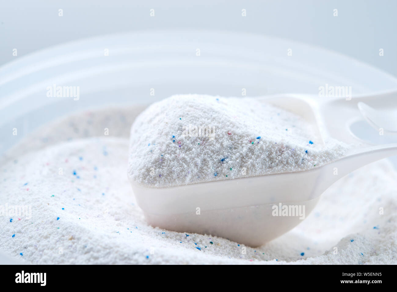 washing powder with measuring cup on a washing powder box Stock Photo