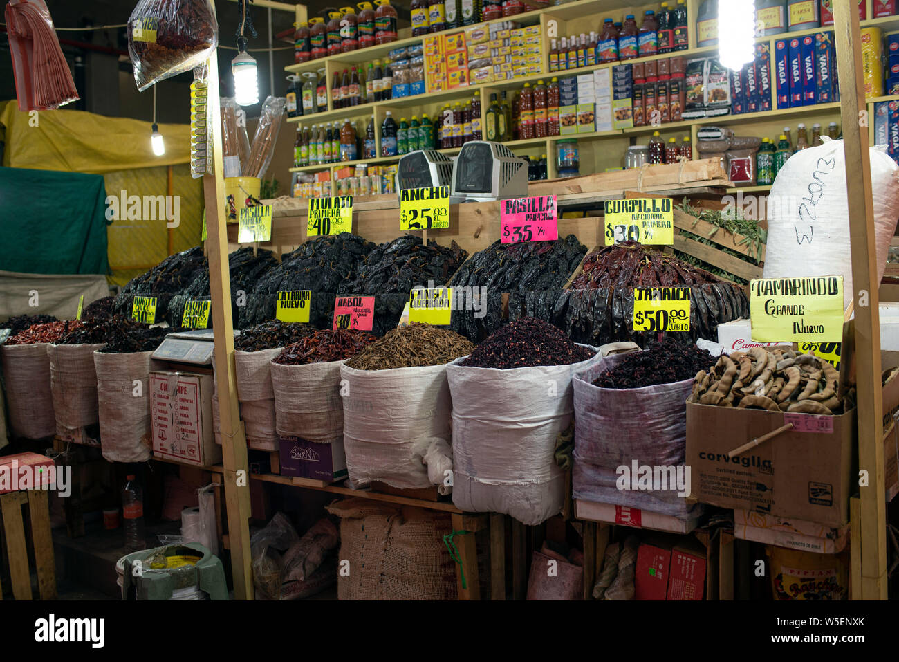 Market stall with labelled sacks of local products for sale in La Merced (Mercado De La Merced) in Mexico City, CDMX, Mexico. Jun 2019 Stock Photo