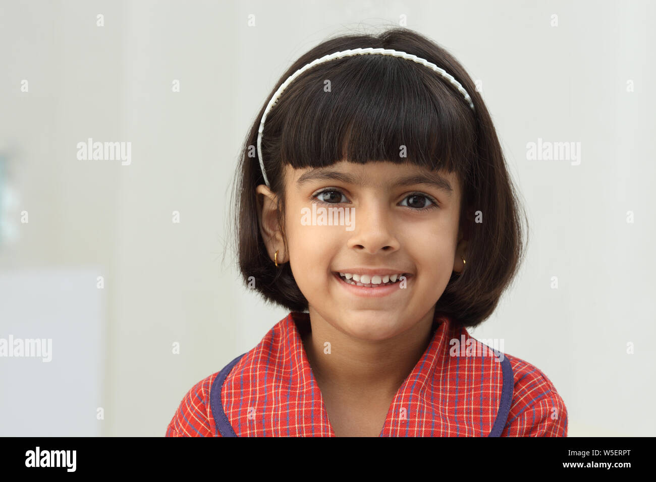 Portrait of a schoolgirl smiling Stock Photo - Alamy