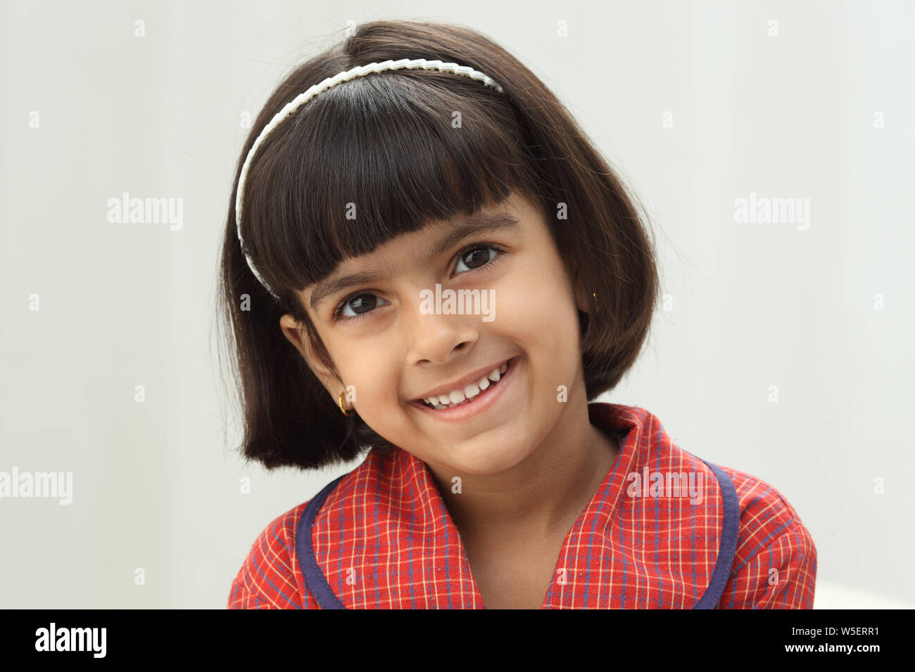 Portrait of a schoolgirl smiling Stock Photo - Alamy
