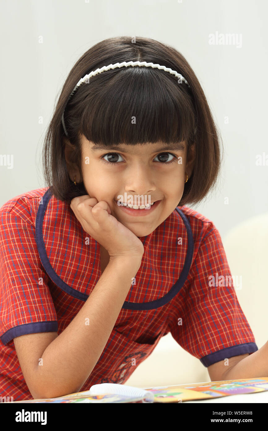 Schoolgirl reading a book Stock Photo - Alamy