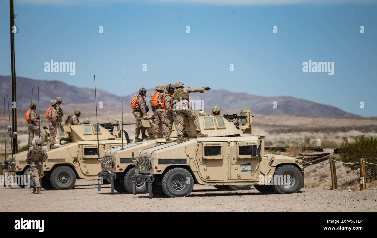 U.S. Marines with Combat Logistics Battalion 2, Combat Logistics Regiment 2, 2nd Marine Logistics Group fire mounted machine guns off Humvee's during integrated training exercise 5-19 at Marine Corps Air Ground Combat Center Twentynine Palms, California, July 24, 2019.  The purpose of ITX 5-19 is to create a challenging, realistic training environment that produces combat-ready forces capable of operating as an integrated Marine Air Ground Task Force. (U.S. Marine Corps photo by Lance Cpl. Scott Jenkins) Stock Photo