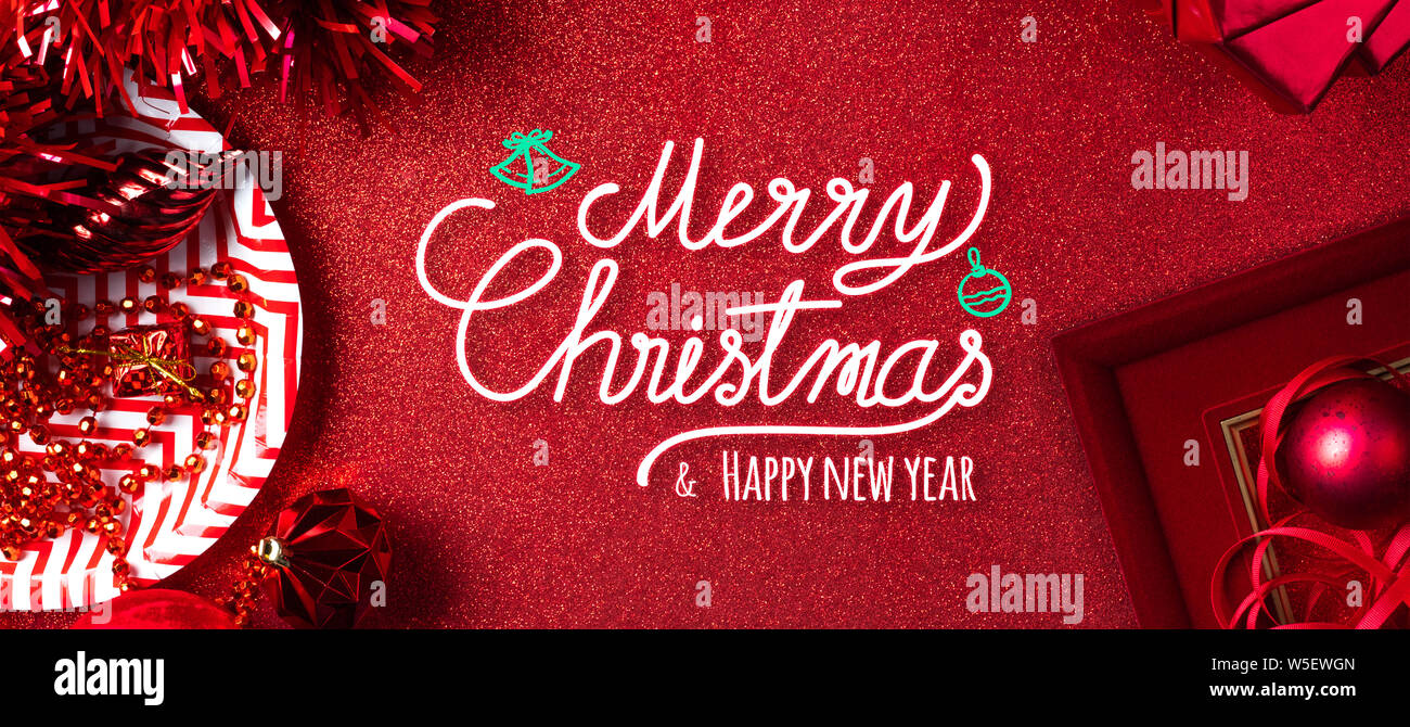 Merry christmas and happy new year red text background.top view of ...
