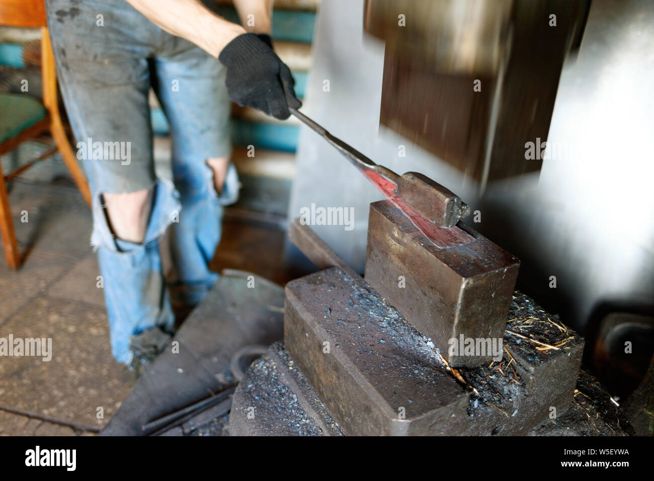 Blacksmith by using pneumatic hammer Stock Photo Alamy