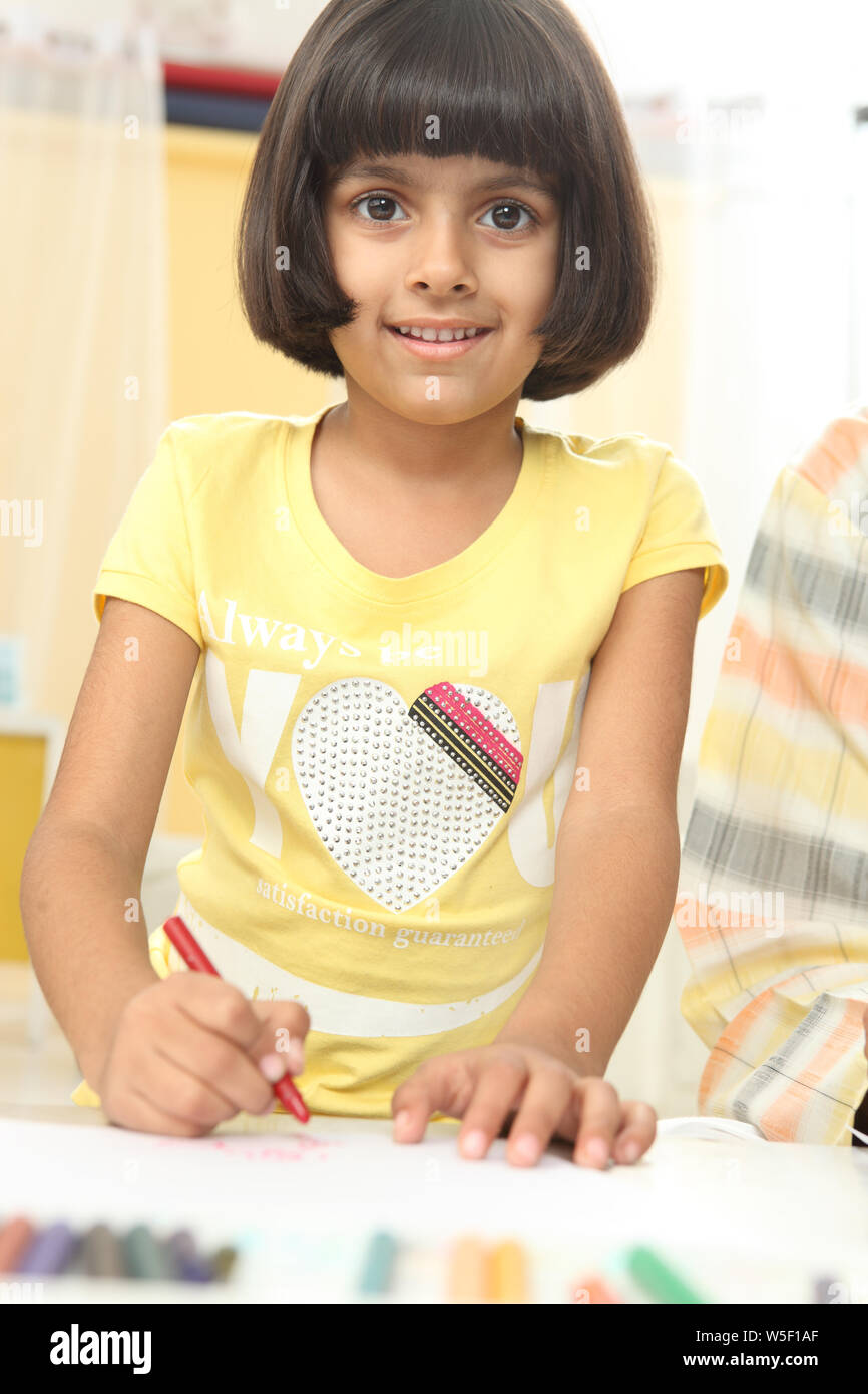 Girl looking colouring book hi-res stock photography and images - Alamy