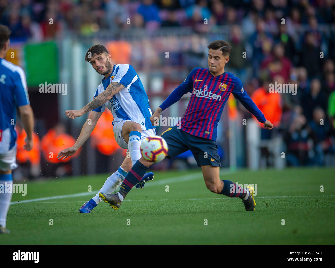 Philippe Coutinho of FC Barcelona, front, challenges Lluis Lopez of RCD  Espanyol during their 29th round match of the La Liga 2018-2019 season at  Camp Stock Photo - Alamy