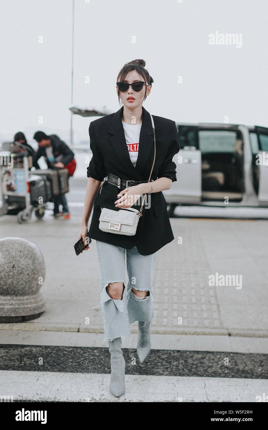 Chinese actress Crystal Zhang or Zhang Tianai arrives at an airport in Shanghai China 6 March 2019. Suit Alexander Wang Bag Fendi Shoes Stuar Stock Photo Alamy