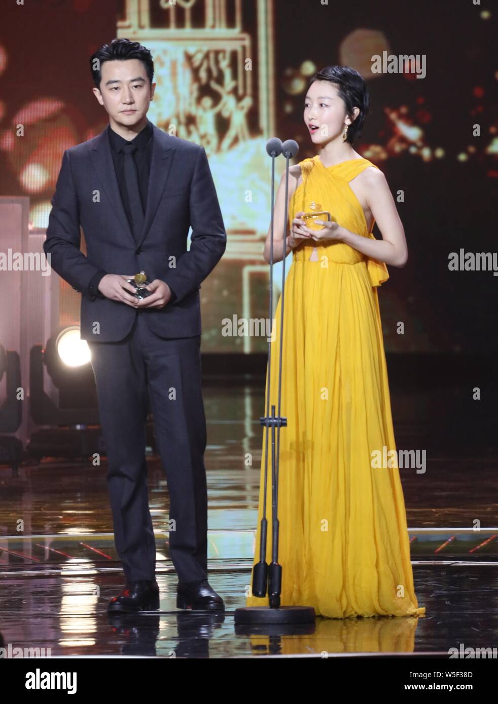 Chinese actress Zhou Dongyu and actor Huang Xuan attend the Chinese  Qualified TV Drama Awards Ceremony held by the Dragon TV in Shanghai,  China, 5 Mar Stock Photo - Alamy