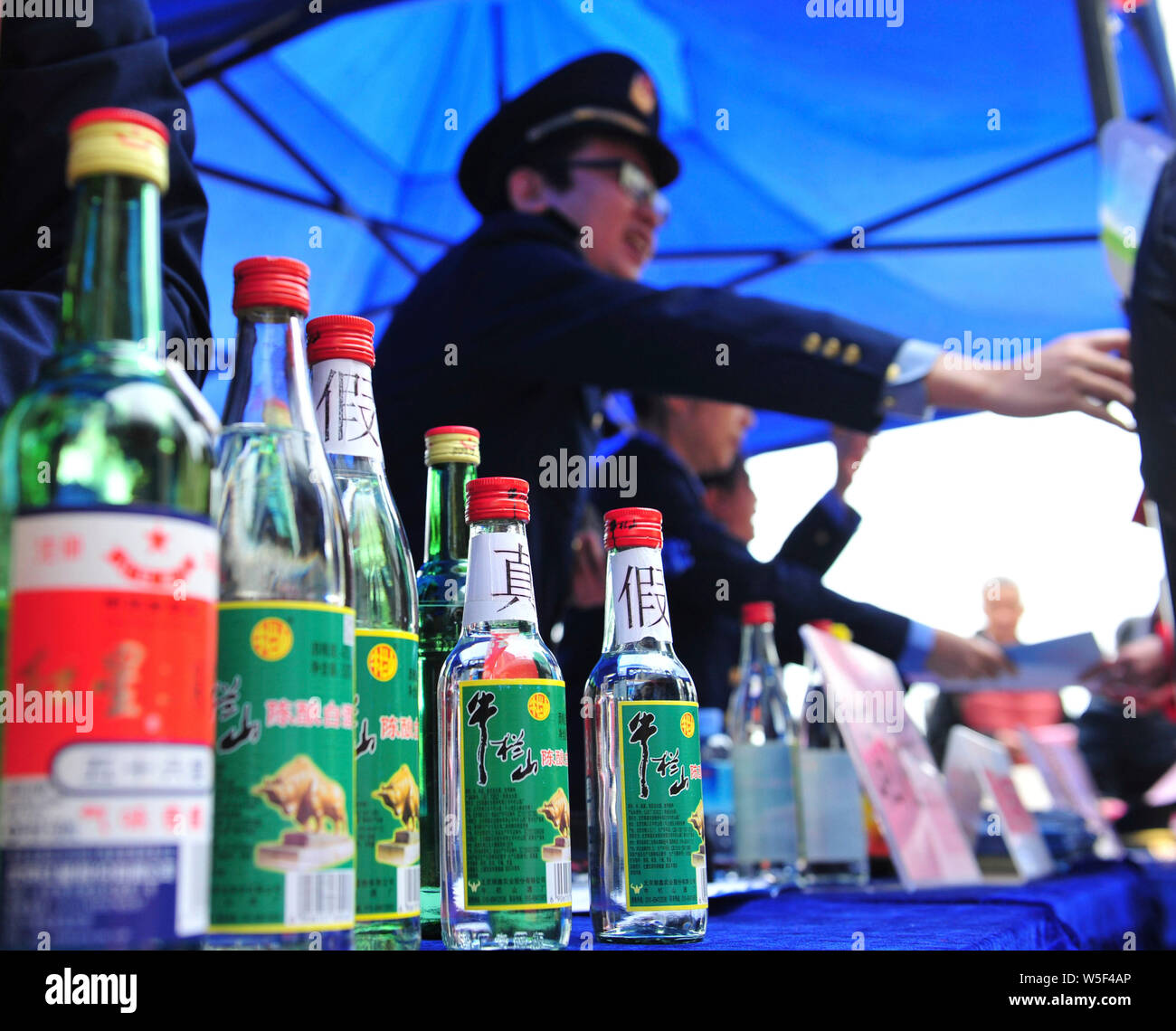 Counterfeits of Baijiu are displayed on the World Consumer Rights Day, often referred to as '315' in China, in Nanning city, south China's Guangxi Zhu Stock Photo
