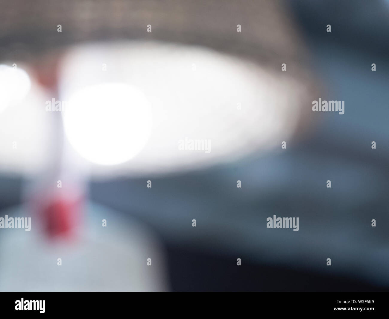 Close-up of a vintage table lamp defocus, The background of the lamp is not clear. Stock Photo