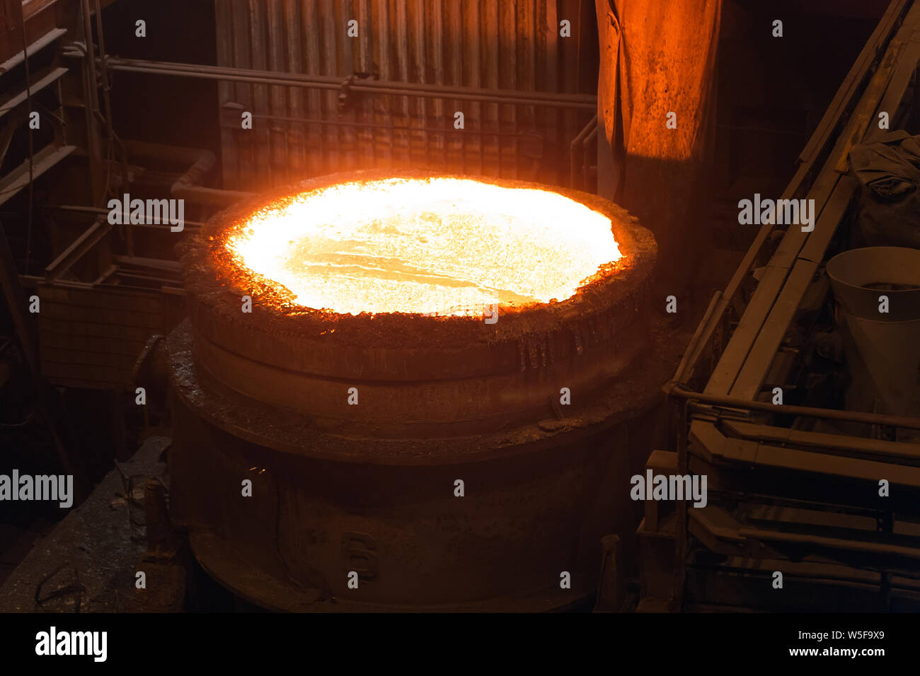 Melting of metal in a steel plant. High temperature in the melting