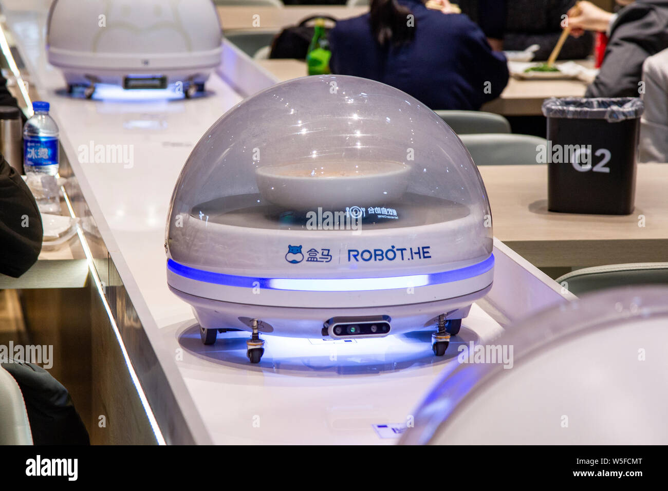 Dishes are delivered the small AI robots at Alibaba's digital restaurant Hema Xiansheng in Shanghai, China, 19 March 2019. Fresh Stock Photo - Alamy