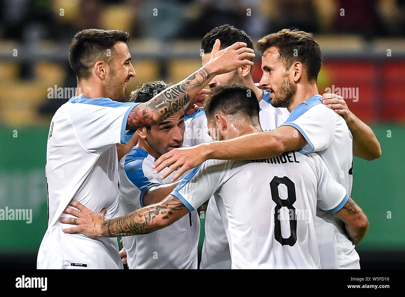 Cristhian Stuani, right, of Uruguay celebrates with teammates after scoring Uruguay's second goal against Uzbekistan during their semi-final match of Stock Photo
