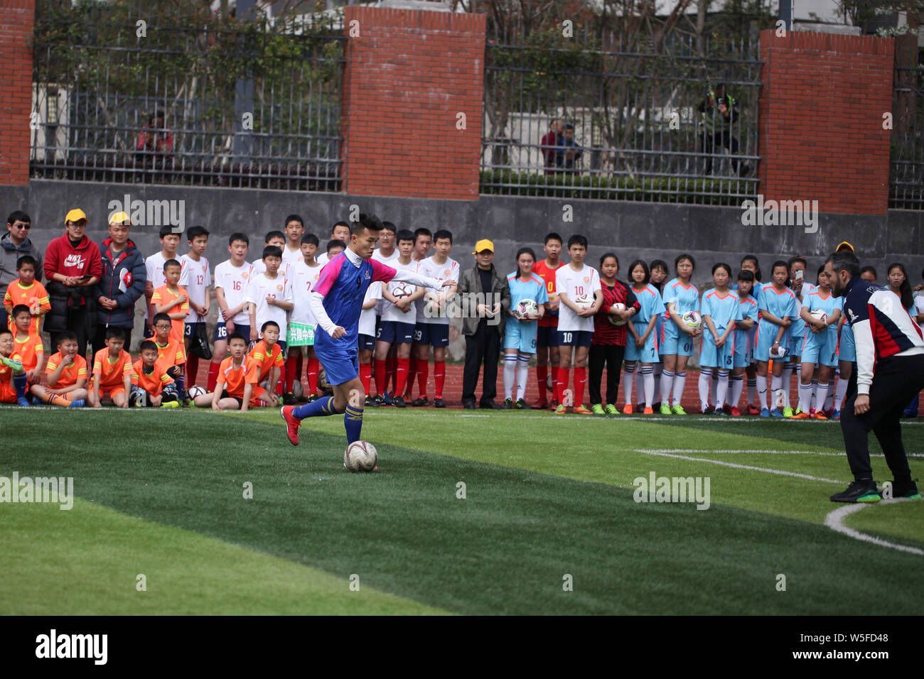 Italian former football player Gianluca Zambrotta plays football with students at an event for the IFDA world legends series - Football Legends Cup - Stock Photo