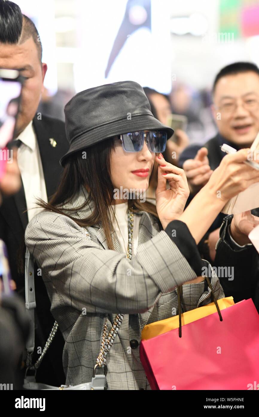 Chinese actress Qin Lan is surrounded by fans as she arrives at an airpport in Shanghai, China, 3 March 2019. Stock Photo