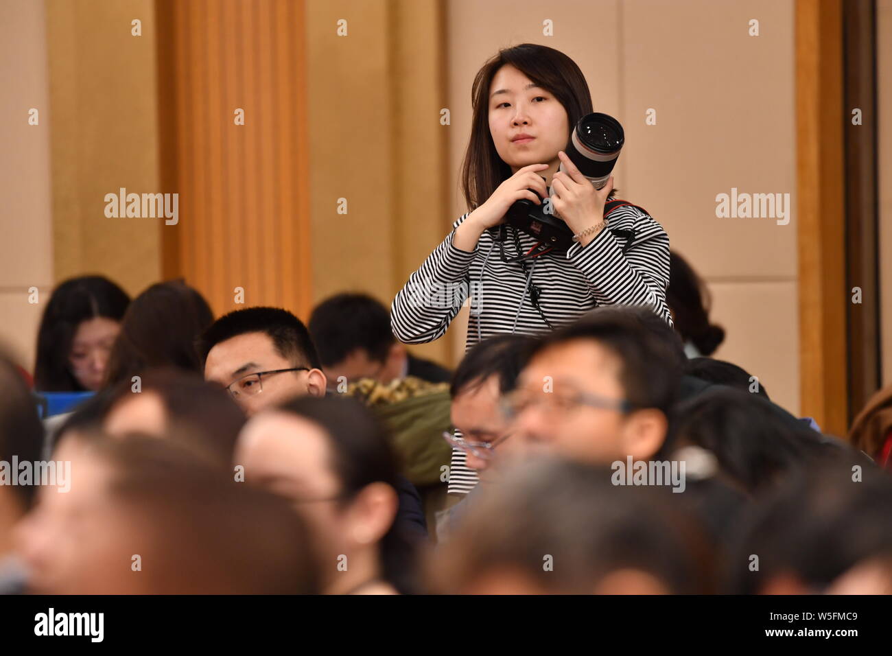 Journalists attend a press conference on advancing the high-quality development of China's economy for the second session of the 13th National People' Stock Photo