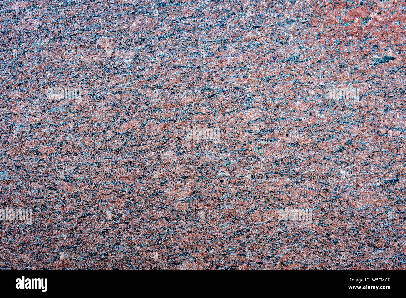 Close up of a gray granite wal tevture - image Stock Photo