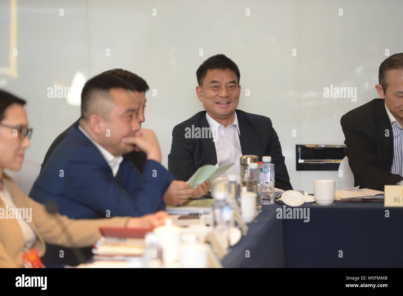 Liu Yonghao, Chairman of New Hope Group, attends a panel session for