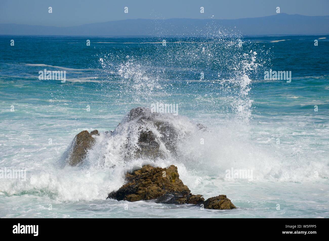 mighty waves dashing on the rocks of the coast of Southern California Stock Photo