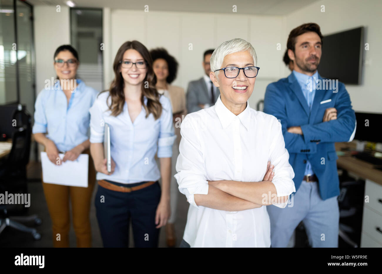 Group of successful business people at work in office Stock Photo - Alamy