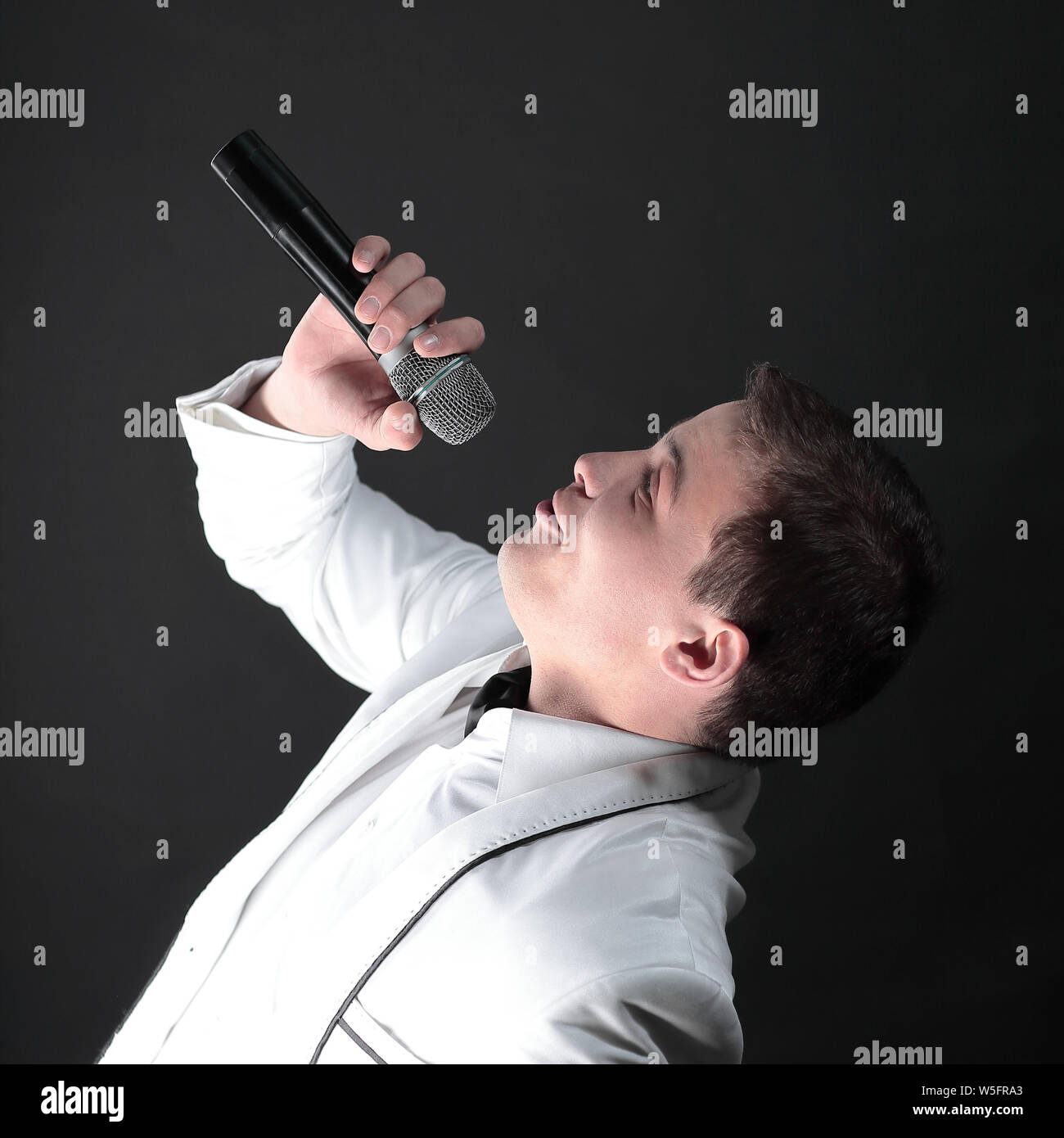 Singing man black suit microphone hi-res stock photography and images ...