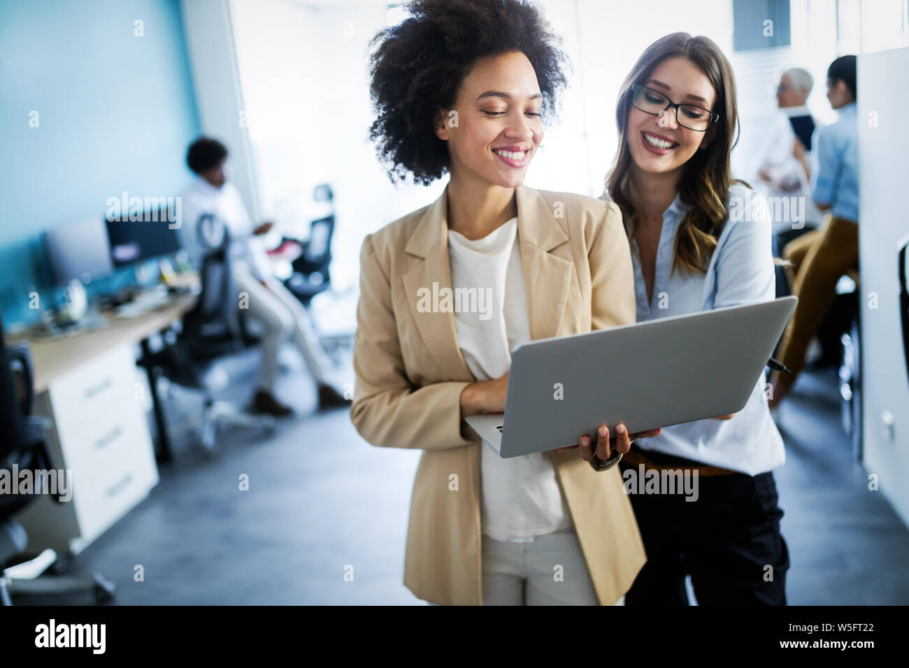 Group of successful business people at work in office Stock Photo - Alamy