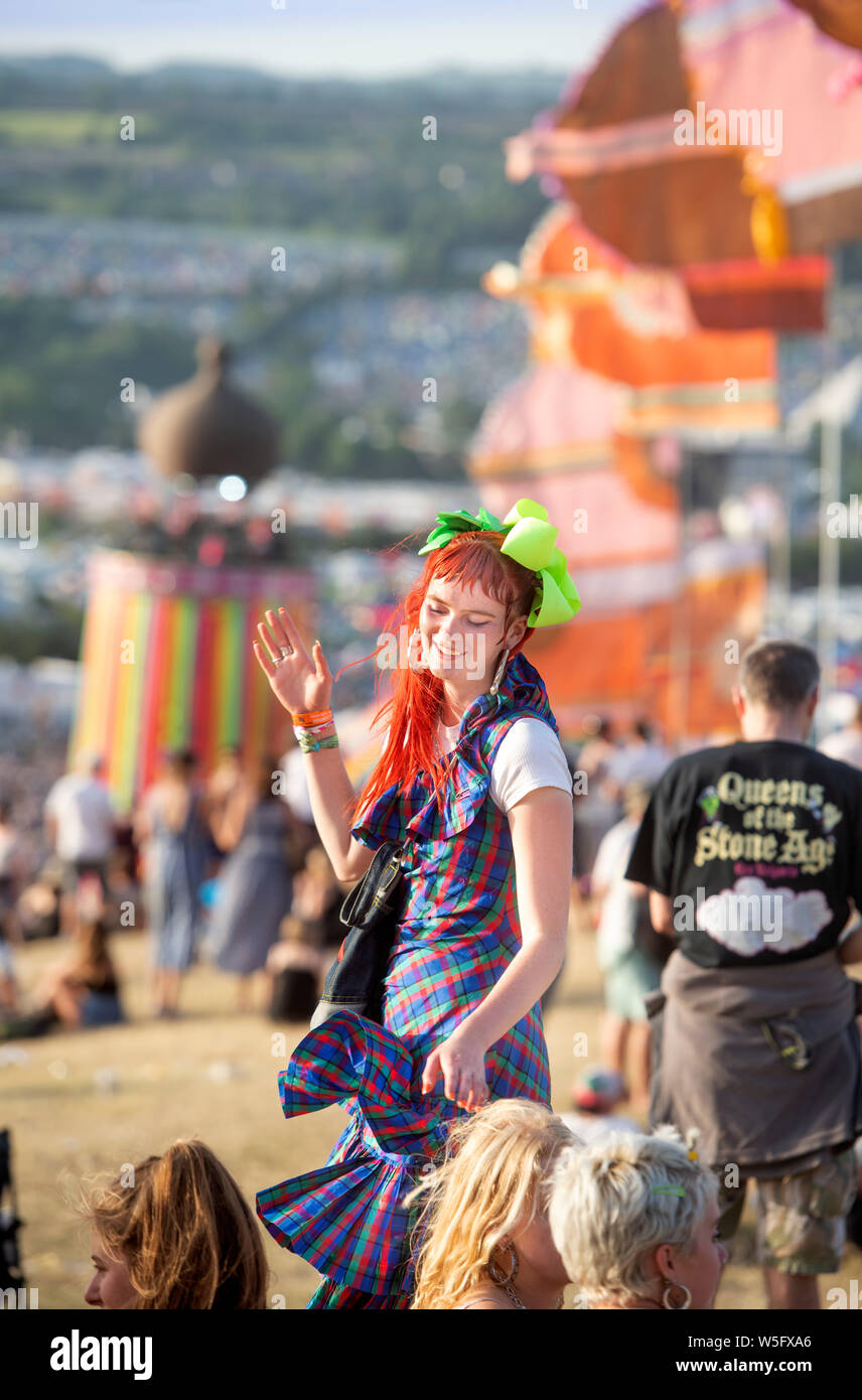 A girl dancing in the Park area at Glastonbury 2019 Stock Photo