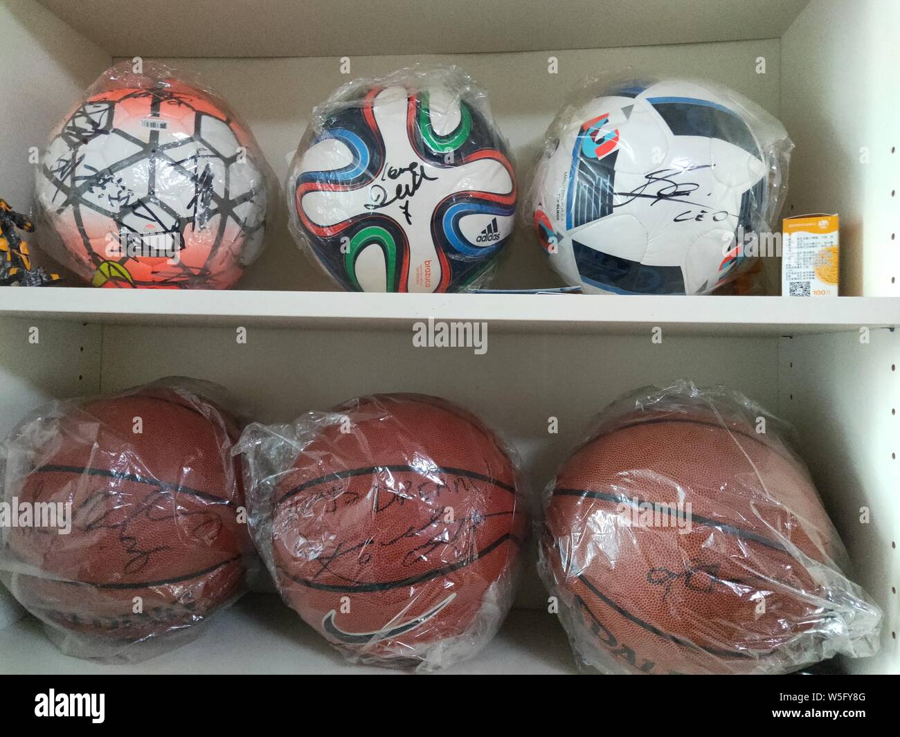 View of signature balls collected by 35-year-old Chinese man in the late stages of Amyotrophic Lateral Sclerosis (ALS) at his home in Beijing, China, Stock Photo