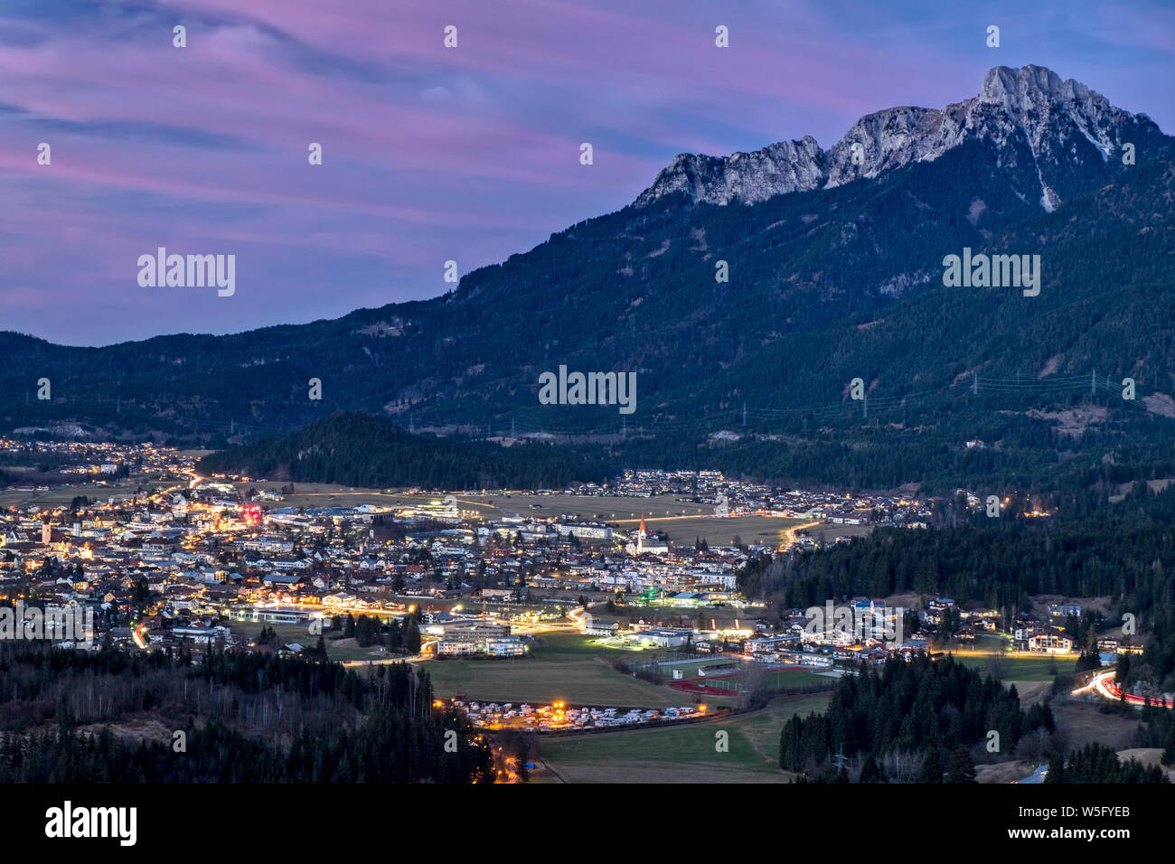 Austria, Tyrol. Naturparkregion Reutte, Reutte and the river Lech valley;bg.: Ammergau Alps and the peak of mount Sauling 2047 m, twilight Stock Photo
