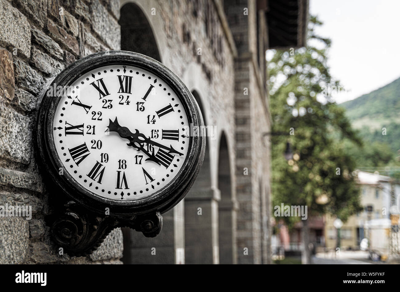 Old retro wall clock at a train station Stock Photo