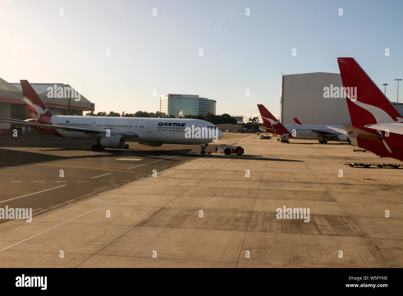 A Qantas Boeing 767 being towed out for departure on a domestic flight