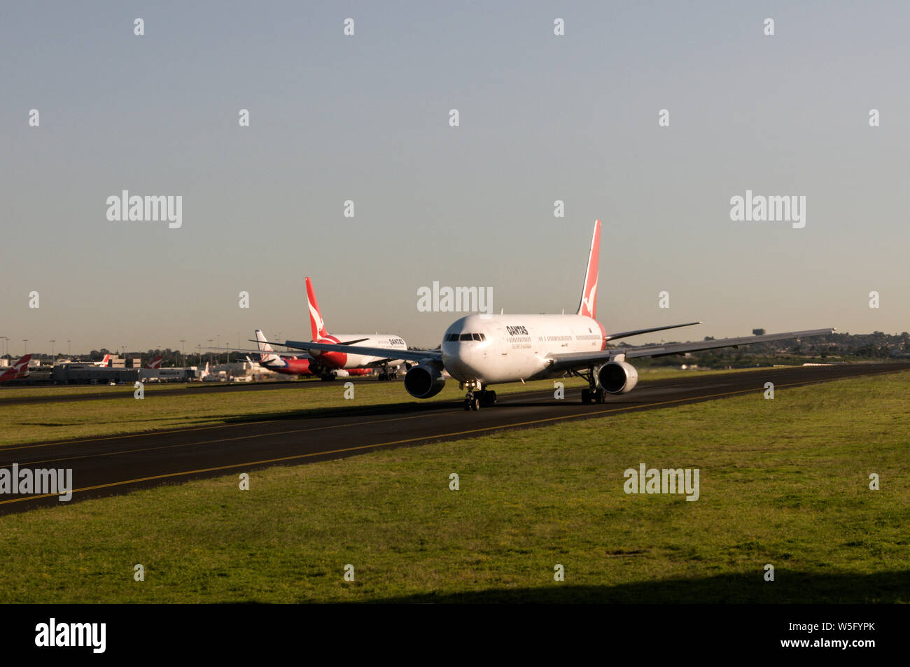 A Qantas Boeing 767 taxing to the main runway at Sydney (Kingsford Smith) airport near Sydney in New South Wales, Australia Stock Photo