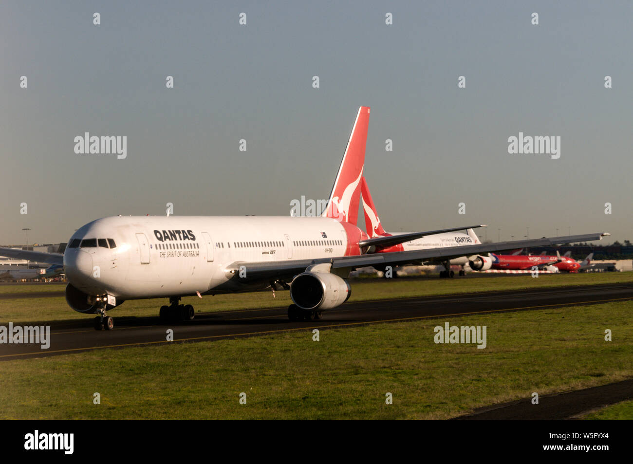 A Qantas Boeing 767 taxiing to the main runway at Sydney (Kingsford Smith) airport near Sydney in New South Wales, Australia Stock Photo