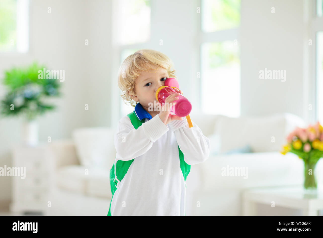 Child going back to school. Kid getting ready for first school day after vacation. Little boy on his way to kindergarten or preschool. Student packing Stock Photo