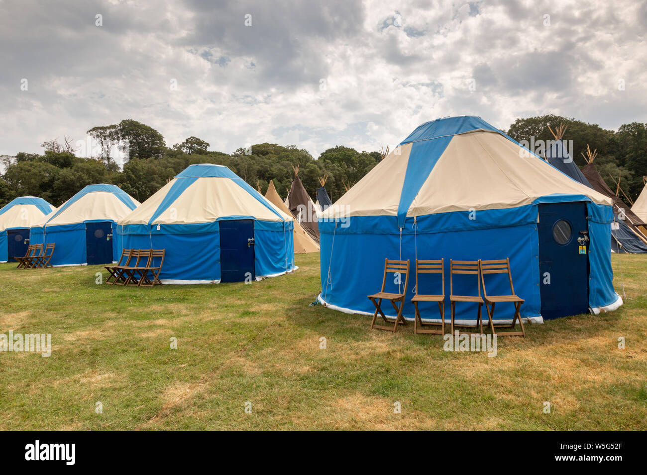 Large high end glamping tents, at an outdoor festival UK Stock Photo