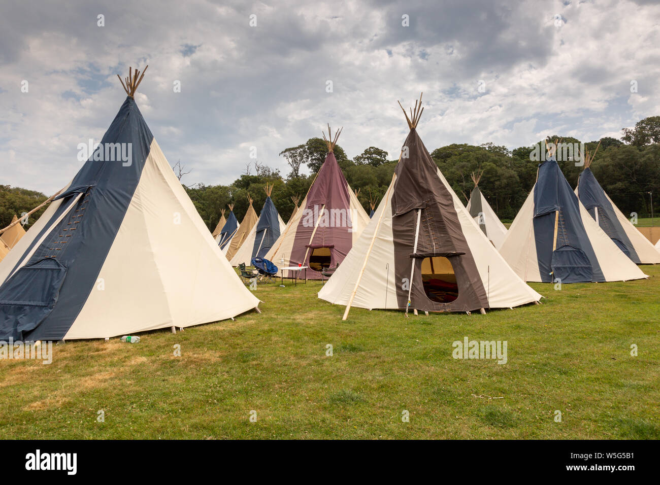 Large high end glamping tents or teepees, at an outdoor festival UK Stock Photo