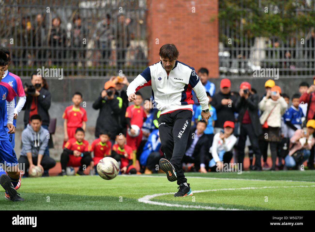 Spanish former football player Fernando Morientes plays football with students at an event for the IFDA world legends series - Football Legends Cup - Stock Photo
