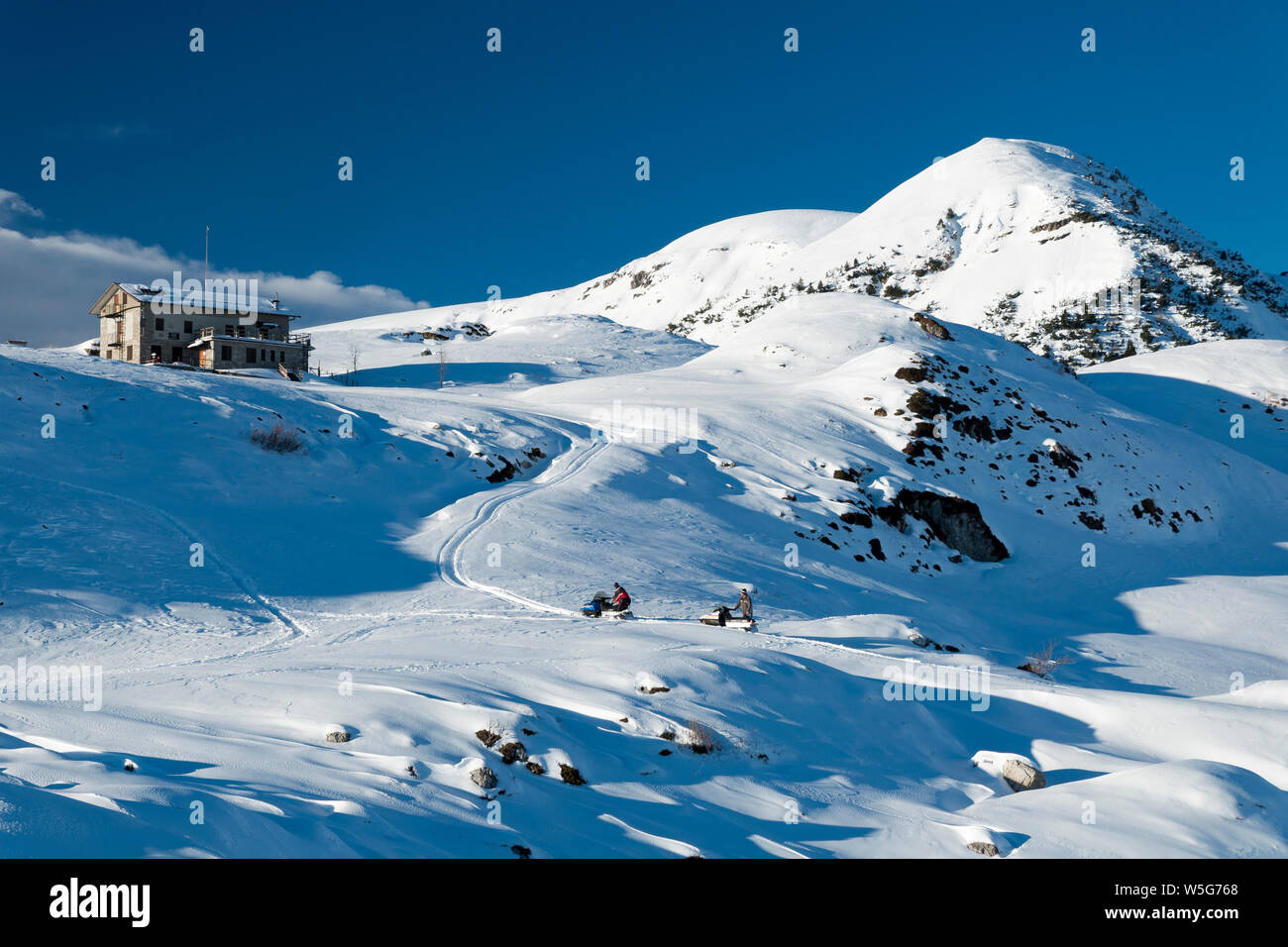 Italy, Lombardy, Orobie Alps Regional Park, snowmobile, Piani d'Alben and Gherardi Hut Stock Photo