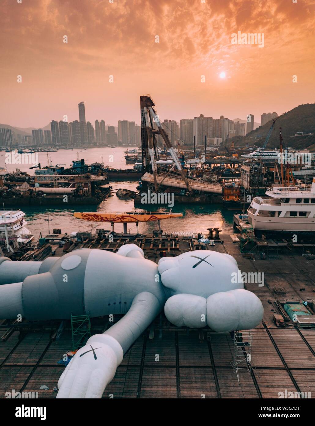 The 37-metre-long floating sculpture by US artist Kaws is placed at the ...