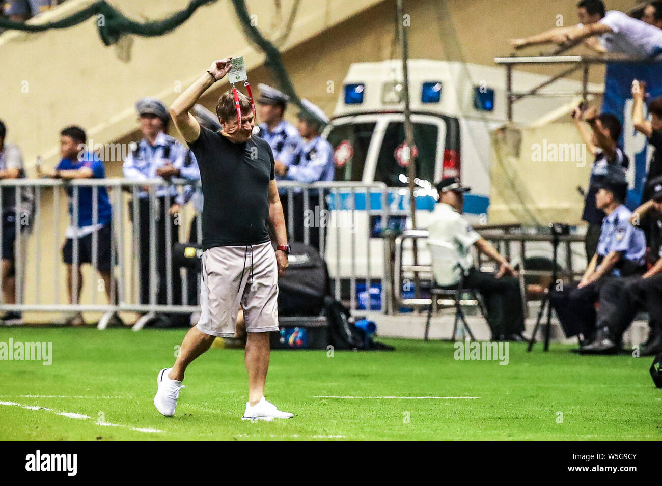 Head coach Dragan Stojkovic of Guangzhou R&F reacts as he watches his players competing against Shanghai Greenland Shenhua in their 20th round match during the 2019 Chinese Football Association Super League (CSL) in Shanghai, China, 27 July 2019. Shanghai Greenland Shenhua defeated Guangzhou R&F 5-3. Stock Photo