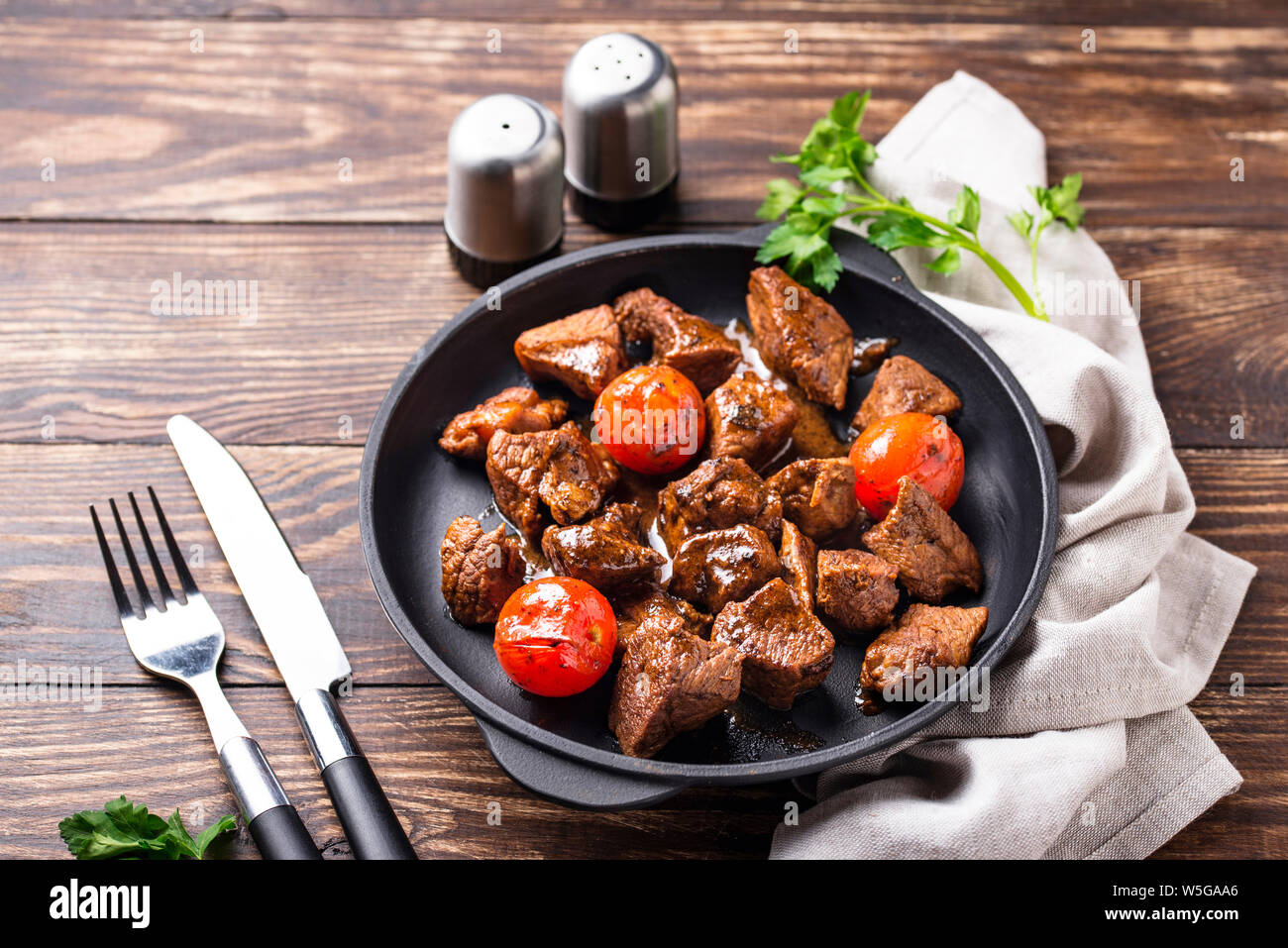 Roasted or stewed beef meat with tomato Stock Photo Alamy