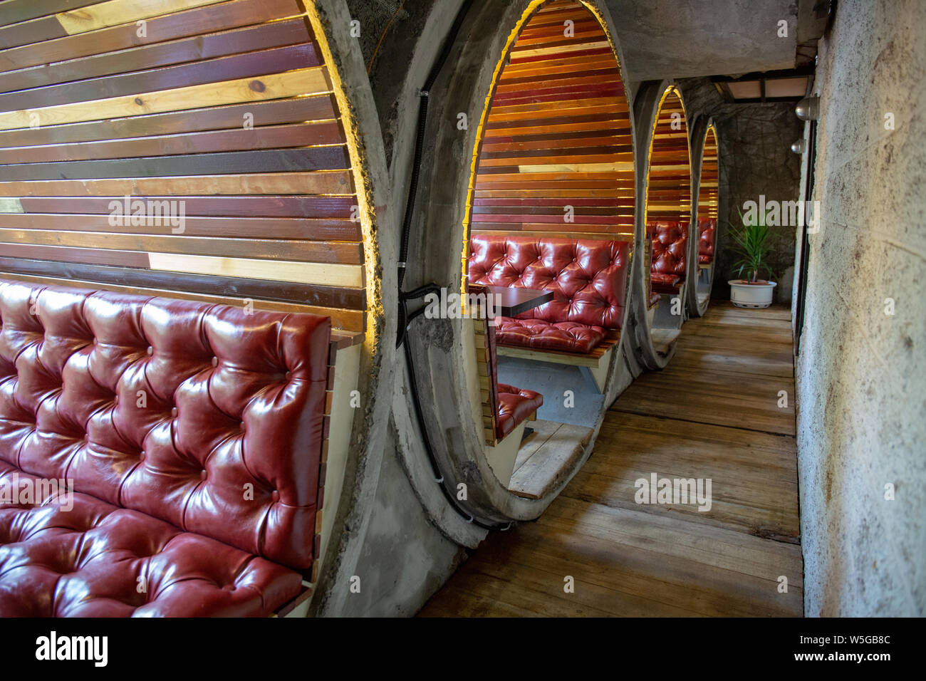 Interior View Of A Private Dining Rooms Made Of Cement Pipes
