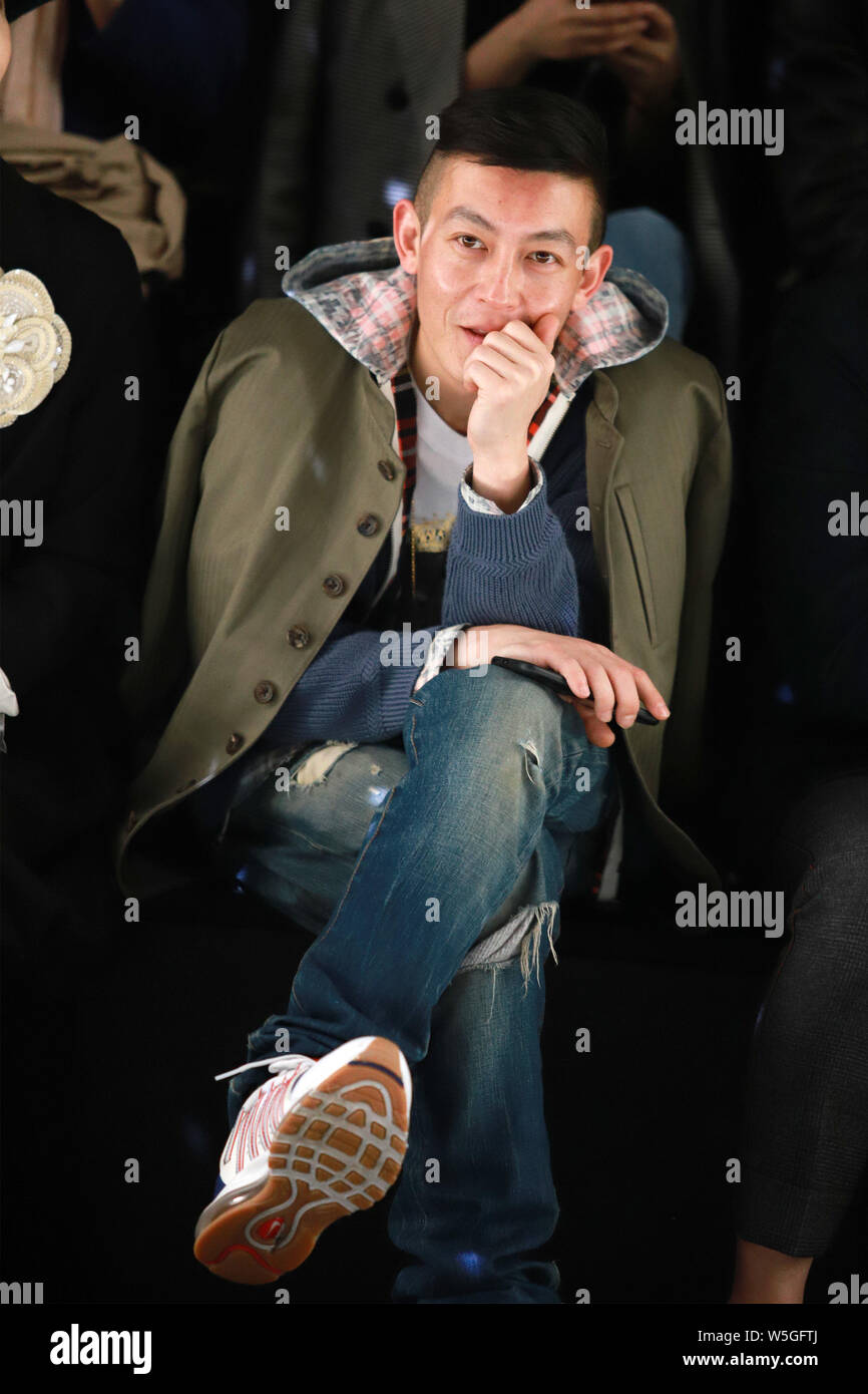 Hong Kong-Canadian actor and rapper Edison Chen watches models displaying  new creations at the Anirac show during the Shanghai Fashion Week  Fall/Winte Stock Photo - Alamy