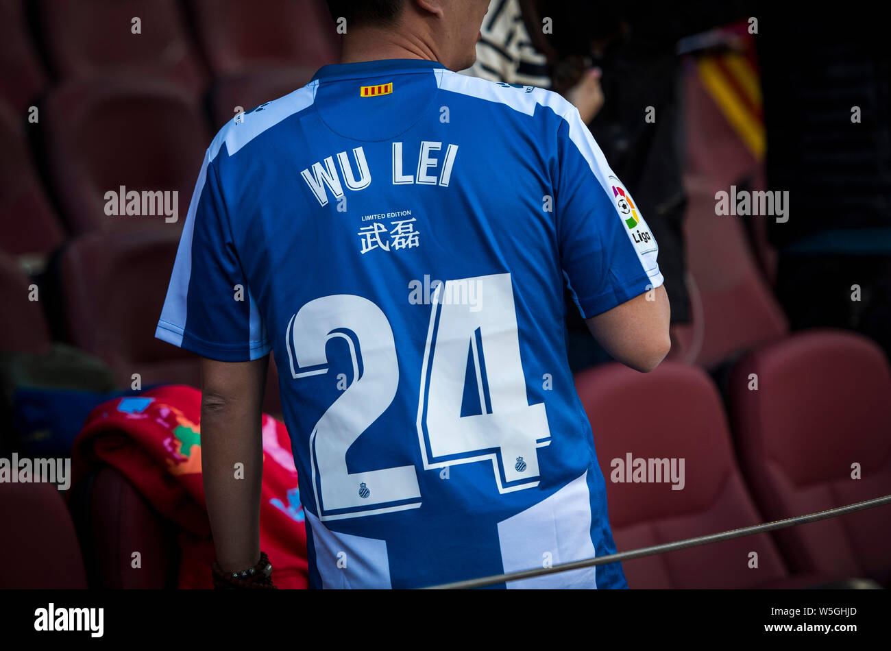 A football fan shows his team jersey of Wu Lei to show his support during  the 29th round match of the La Liga 2018-2019 season between RCD Espanyol  an Stock Photo - Alamy