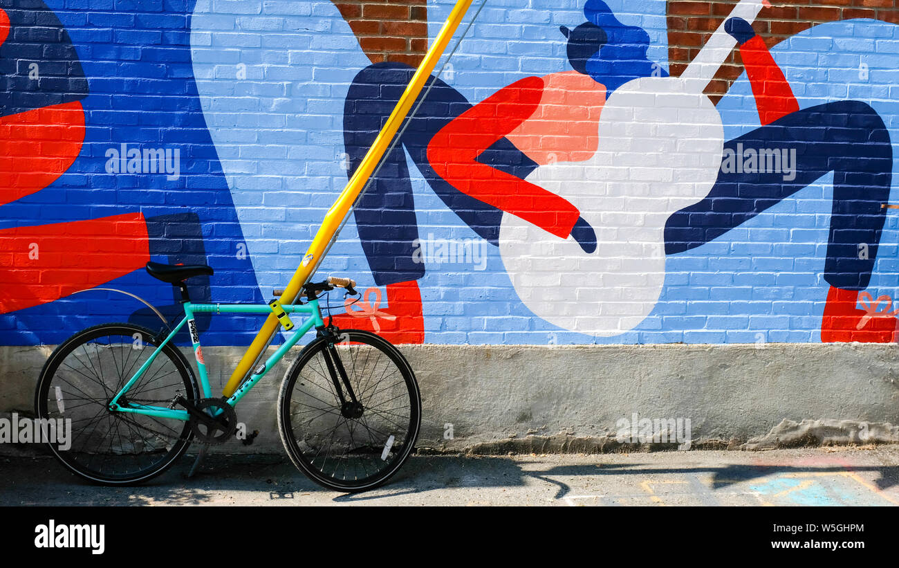 Bicycle parked in front of Mural , Villeray, Montreall Stock Photo